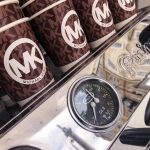 Michael Kors branded mobile coffee cups