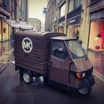 Mobile coffee van branded with the Michael Kors MK logo