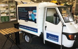 branded-mobile-coffee-van-hire-at-an-exhibition the mobile coffee branded van at an exhibition