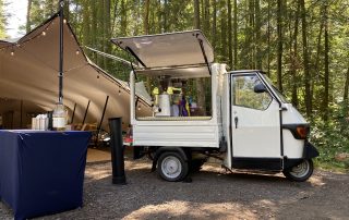 mobile-piaggio-ape-van-at-an-outdoor-event The Mobile Coffee Bean Piaggio Ape van at an outdoor event